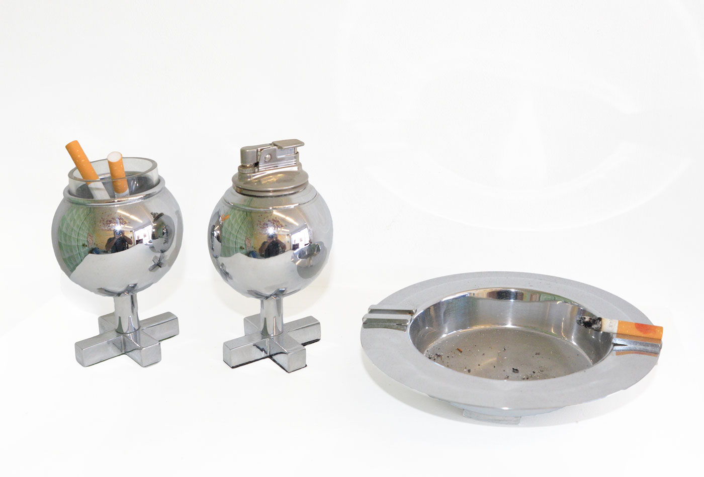 Charles Hollis Jones, Polished chrome Hugs and Kisses Ball-Line Lighter and Cup Polished chrome Box-Line Ashtray, 1963, Polished chrome