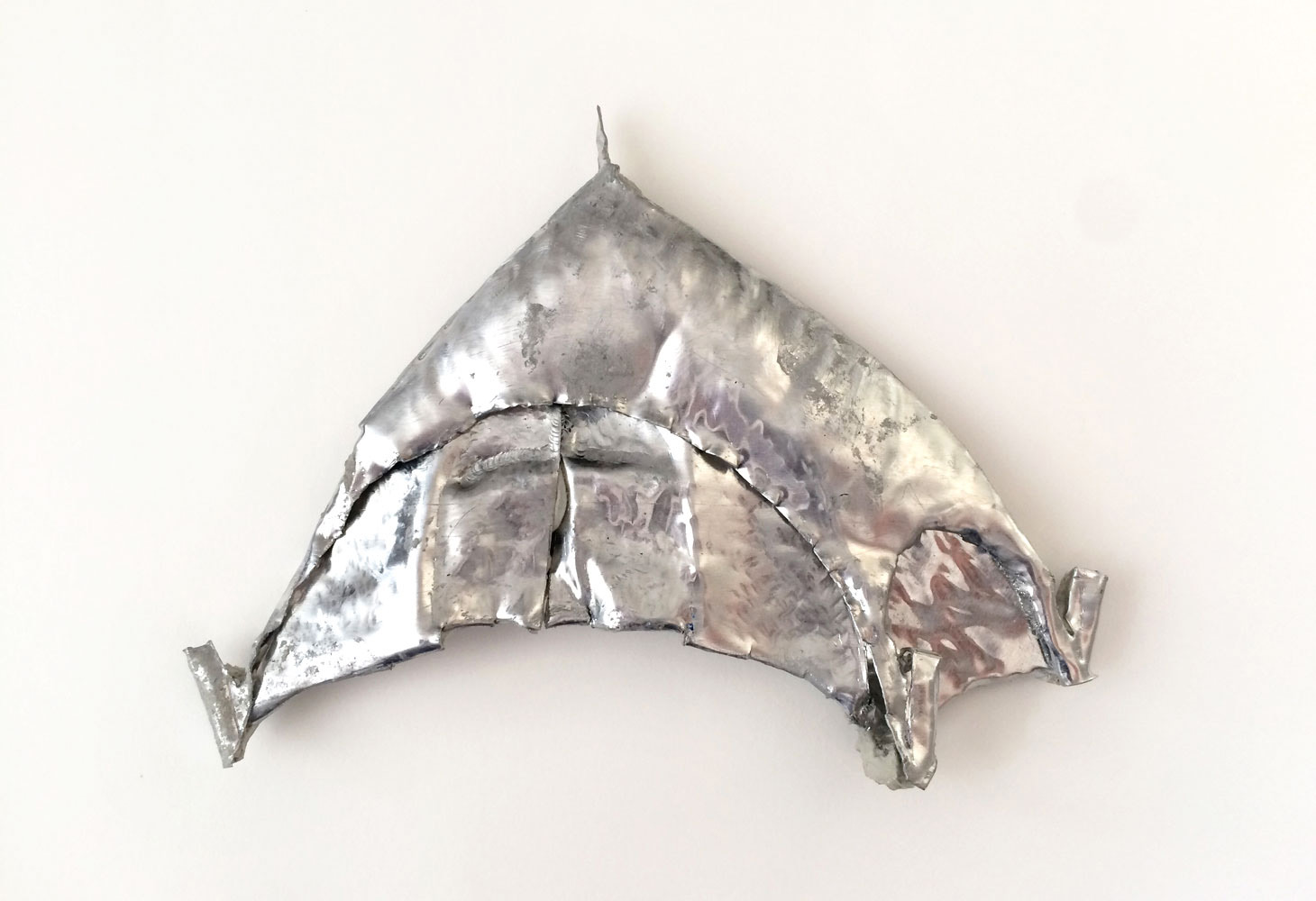 Michael Assiff, Veteran angel (Tent), 2018, Aluminium repoussé and Bondo, 6 x 4.25 x .25 inches